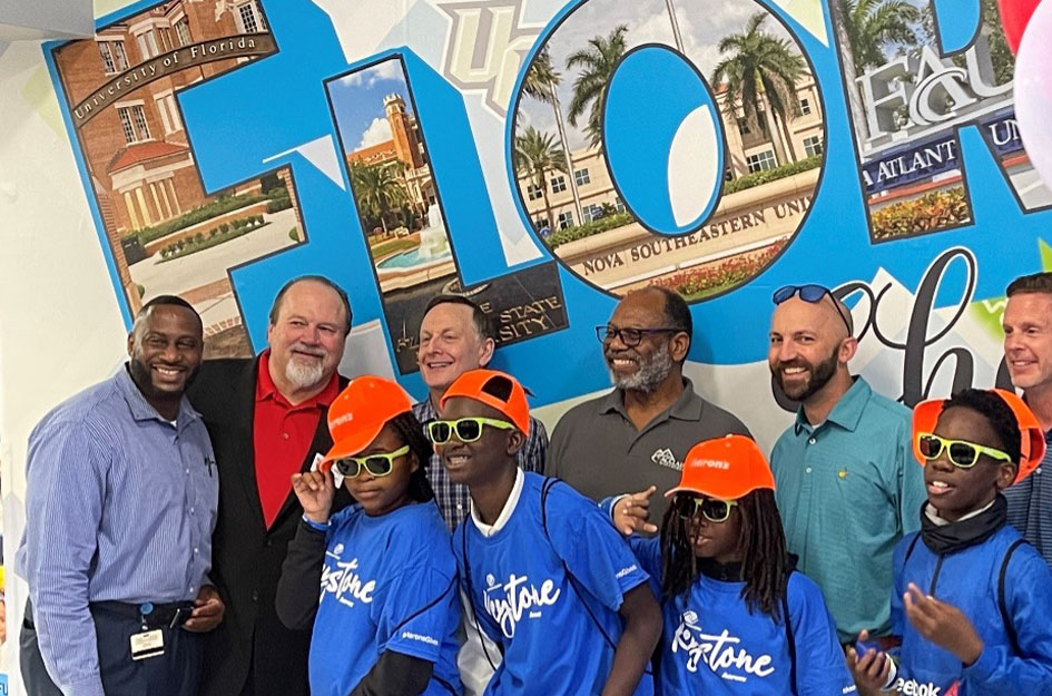 Aaron's refresh - Aaron's team and Club kids smiling at camera