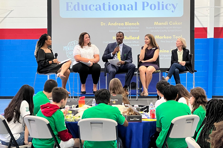 Group of teens listening to Educational Policy panel discussion