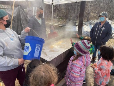 Boys & Girls Club of Bay Mills youth maple syrup processing after tapping from nearby forest