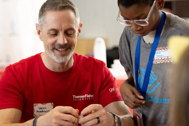 ThermoFisher volunteer and Club kid