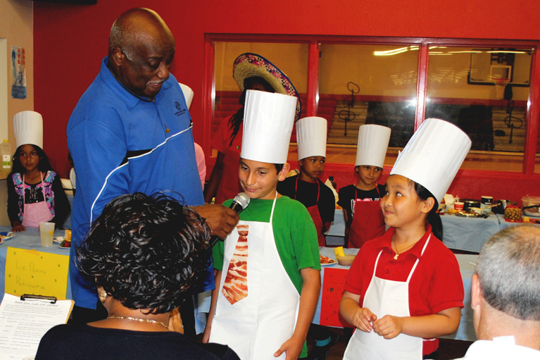 Mr. Cooper and Club kids in chef hats