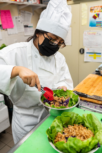 Student chef preparing meal