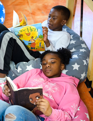 Club kids reading their books