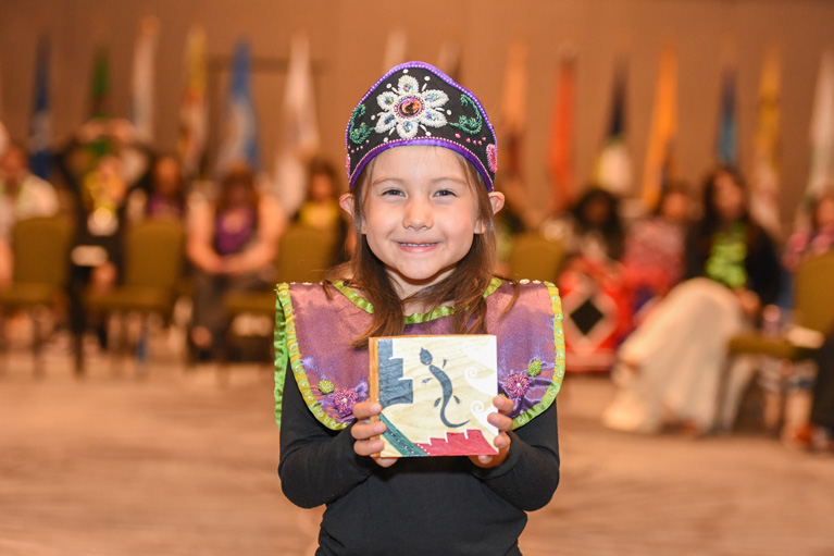 Adorable Native American Club kid smiling at camera