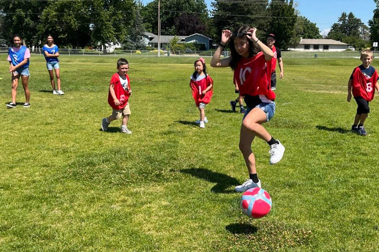 Dalilah playing soccer