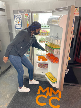 Club teen in front of fridge