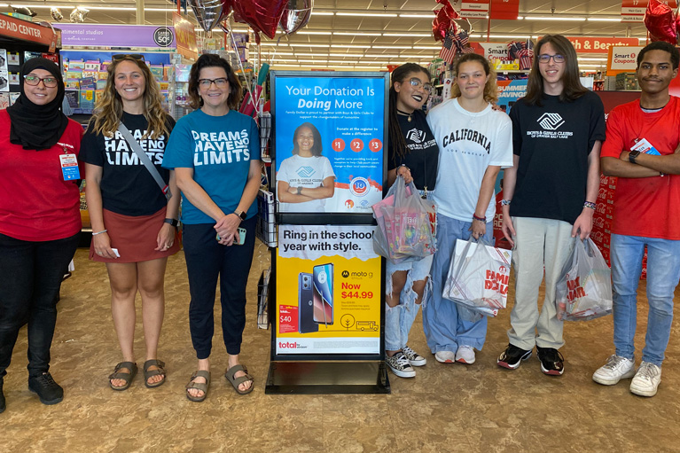 Family Dollar associates with Club kids at store
