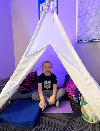 Club kid in Zen tent