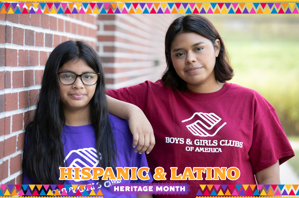 Two Hispanic & Latino Club kids smiling at camera
