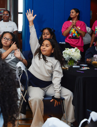 Club kid raising hand - Hispanic Heritage Month