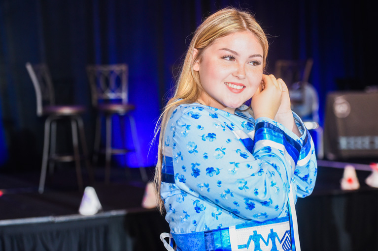 Girl Puts on Earrings