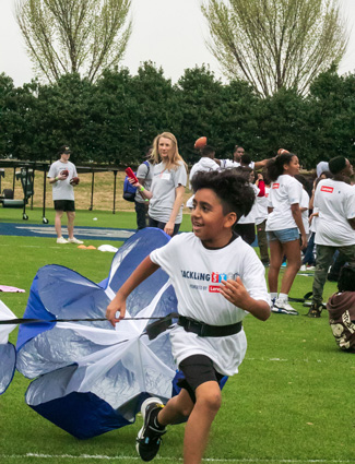 Photo taken by Isaac featuring youth at “Beyond the Field: Tacking STEM” event