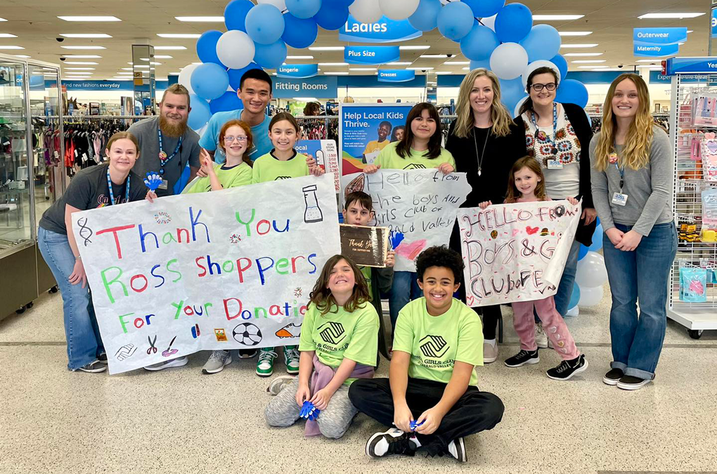 Group Photo In Ross Store Smiling At Camera Thank You Ross Customers sign