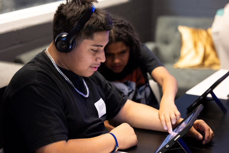 Club teens in tech room