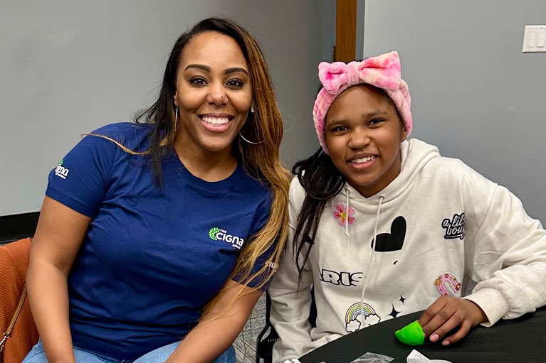 The Cigna Group volunteer and Club kid