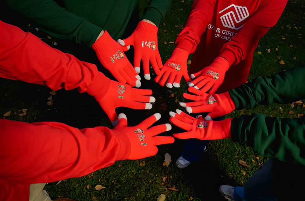 East Harlem teens spread kindness by debuting original designs at Coca-Cola’s Holiday Caravan.