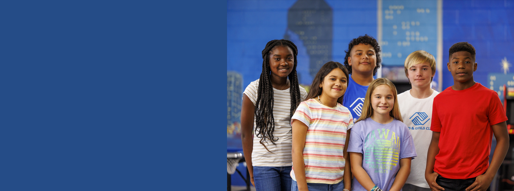 Diverse group of kids smiling at the camera