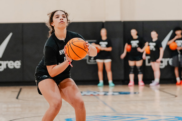 Club teen shooting basketball