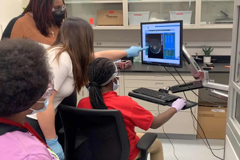 Camarria in lab with other Club kids