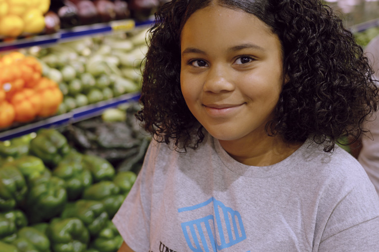 Club kid in grocery store