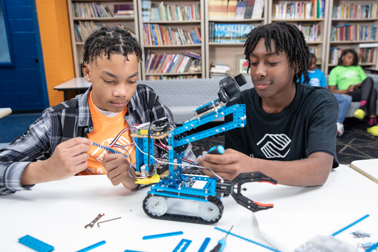 Club teens working on a STEM project