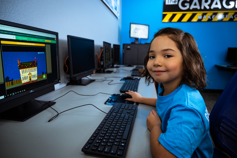 Club kid working on computer