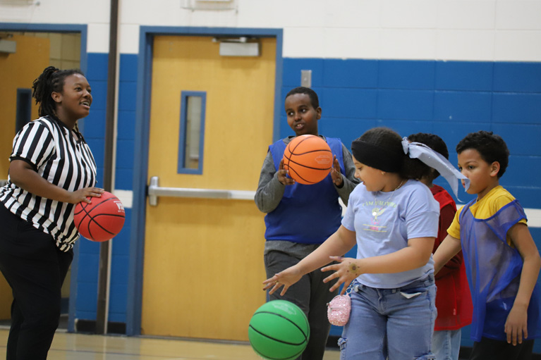 Brook'Lynn reffing basketball