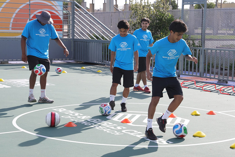 Club kids practicing soccer