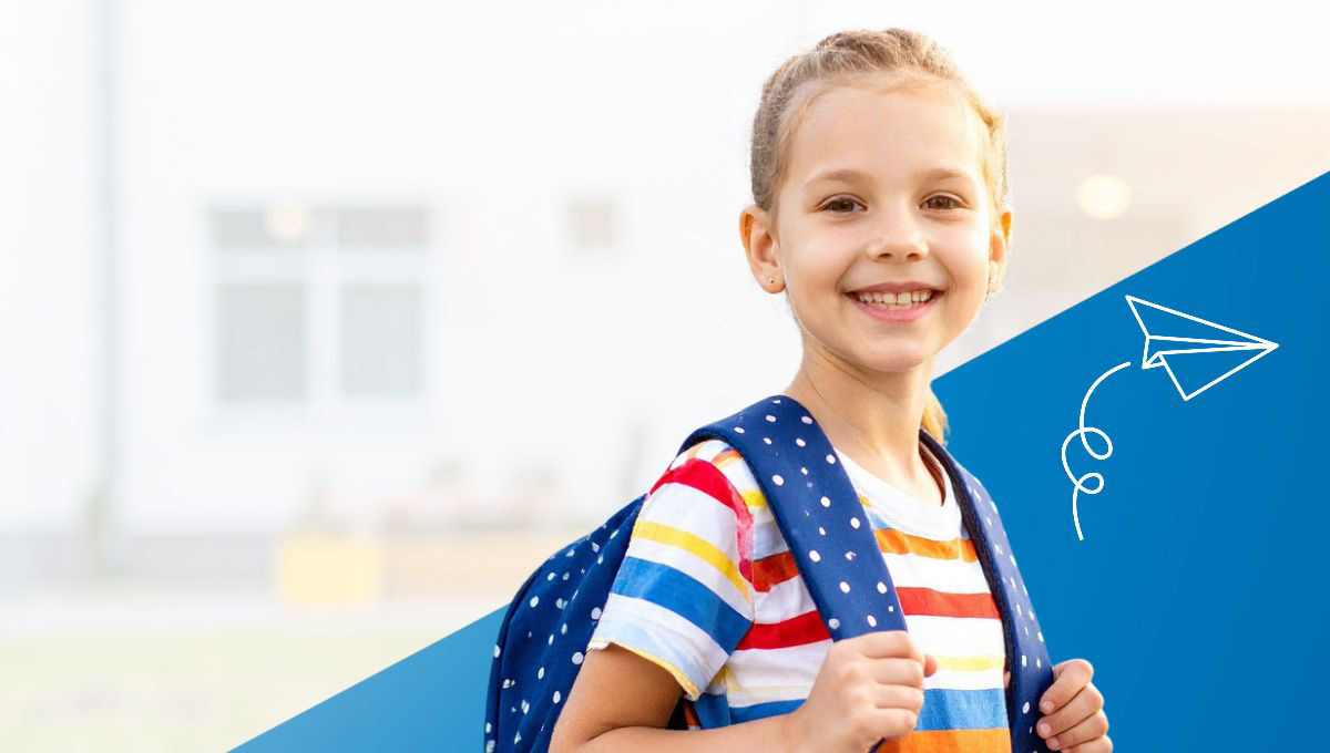 After school match - Cute little girl with back pack smiling at camera