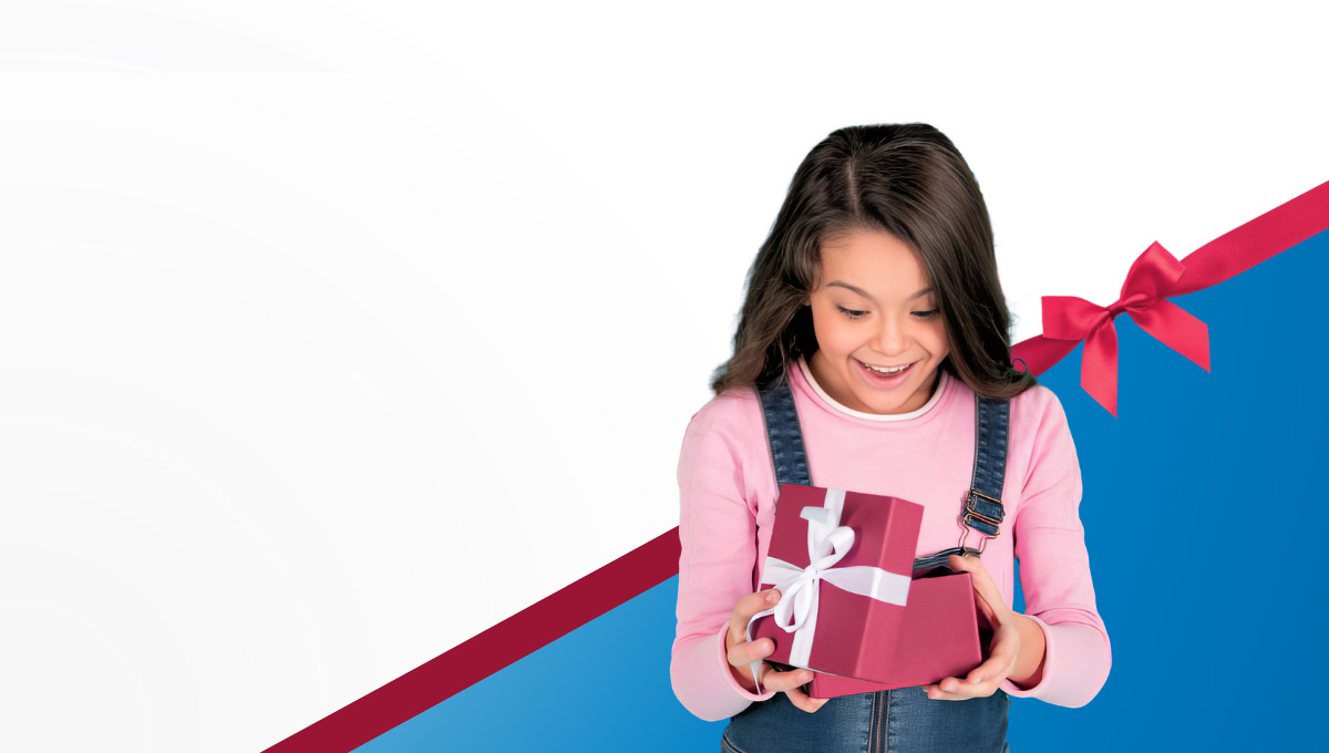 Holiday Gift Guide - Girl smiling at gift